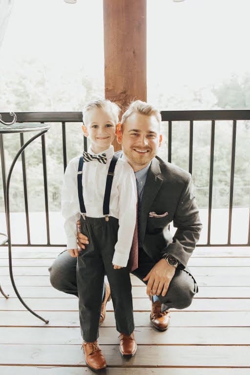 A man and a young boy in formalwear