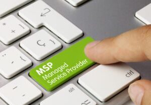 A man pressing the Msp managed service provider key